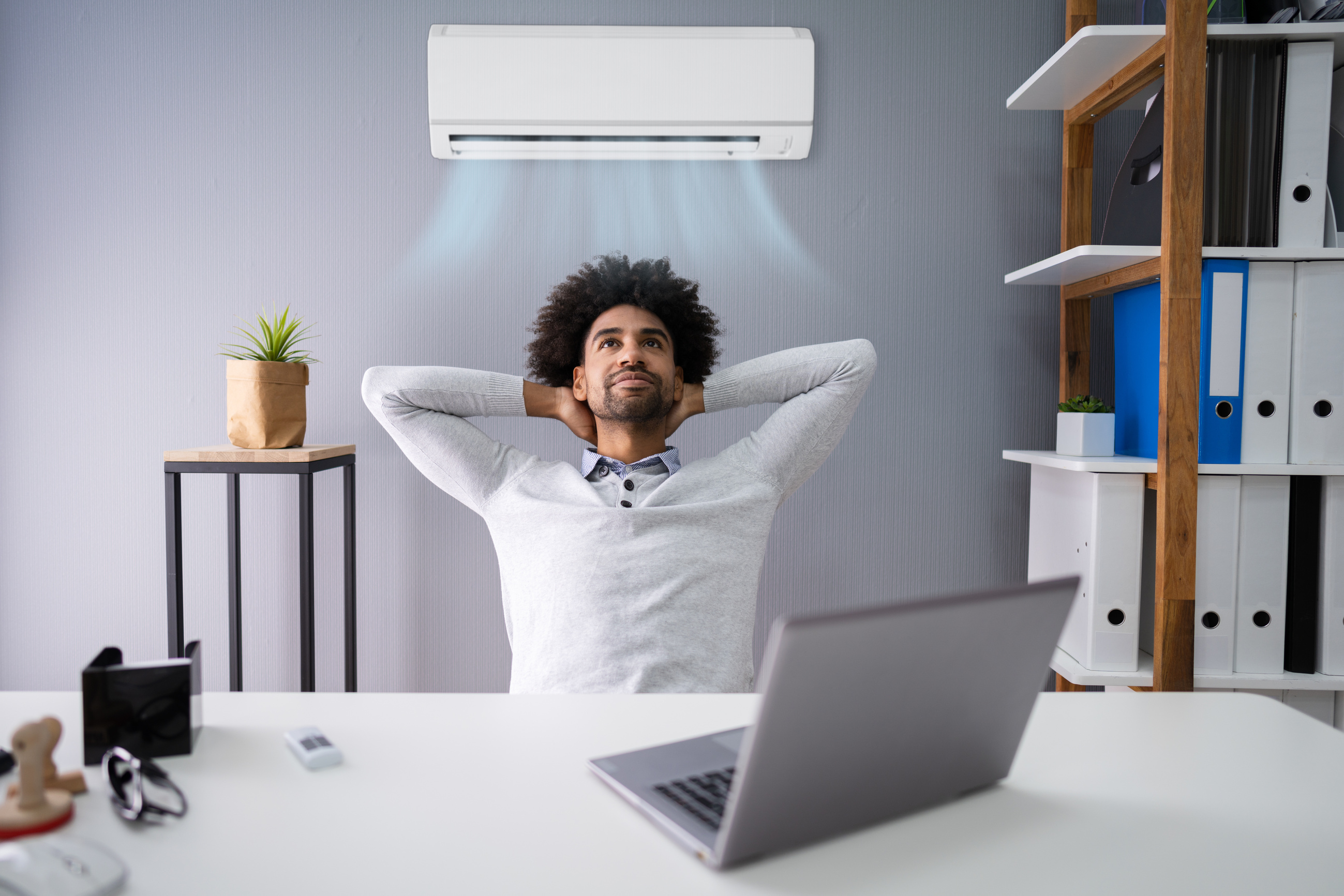 Businessman Working in the Office with Air Conditioning
